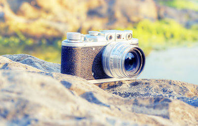 Close-up of camera on rock