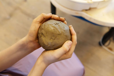 Cropped hand of person holding food