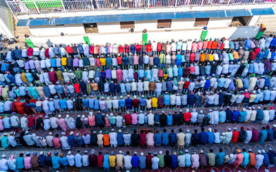 High angle view of people praying outdoors