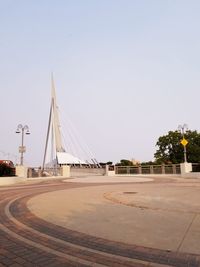View of bridge over road against clear sky