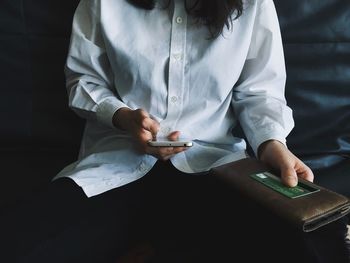 Close-up of man using mobile phone