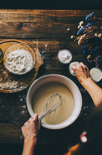 High angle view of woman preparing food on table