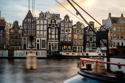 Narrow dutch crooked houses at waterfront