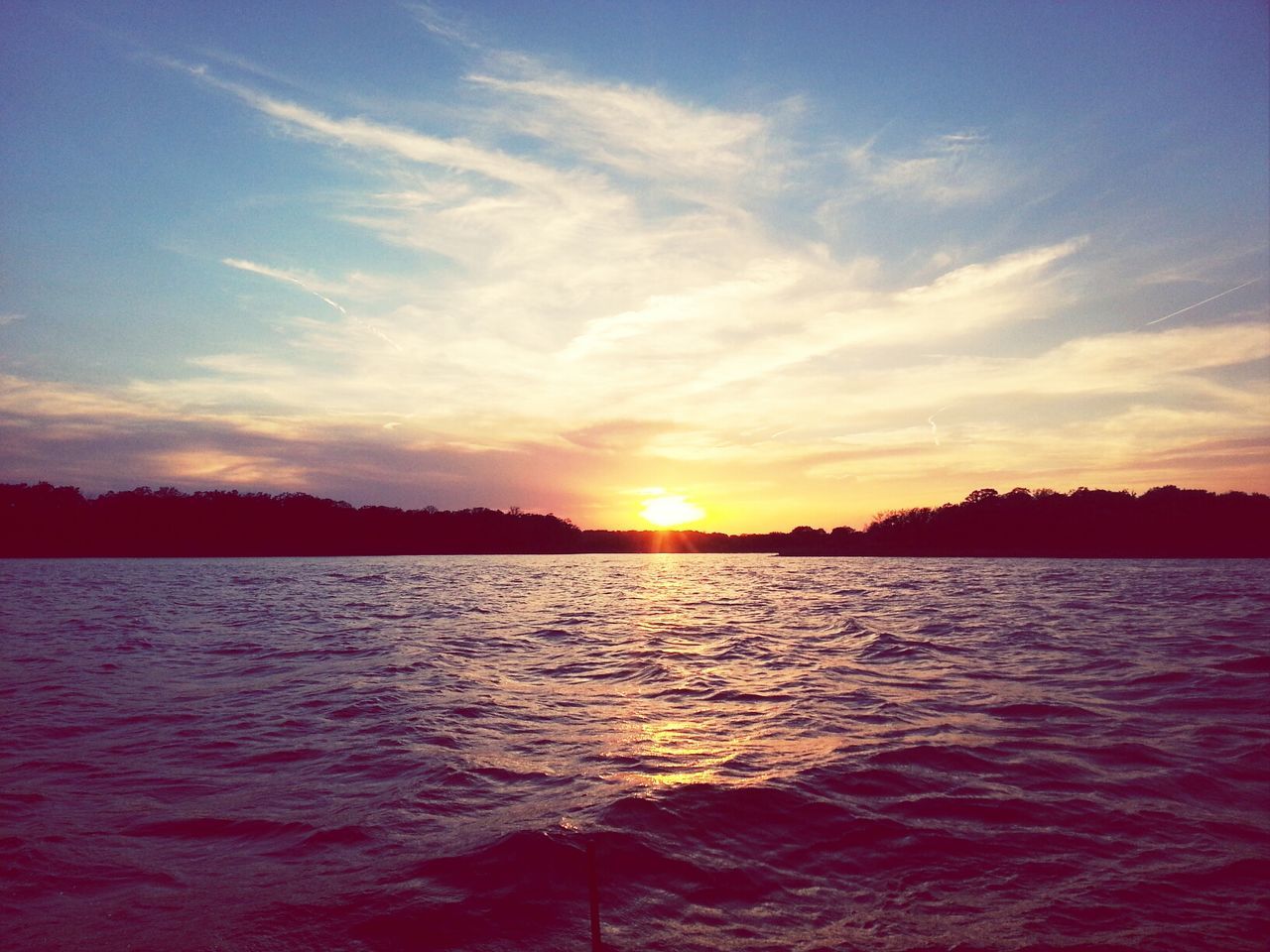 sunset, water, tranquil scene, scenics, tranquility, sun, beauty in nature, sky, reflection, silhouette, nature, idyllic, waterfront, lake, rippled, orange color, sunlight, cloud - sky, tree, river