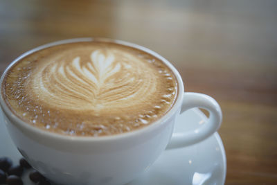 Close-up of cappuccino on table