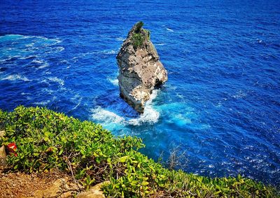 High angle view of rock formation in sea