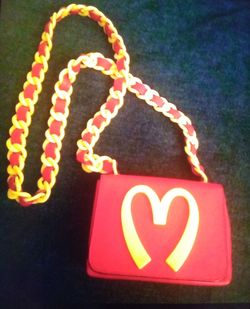 Close-up of heart shape text on red paper