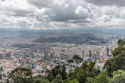 High angle view of trees and buildings against sky