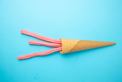 High angle view of cake against blue background