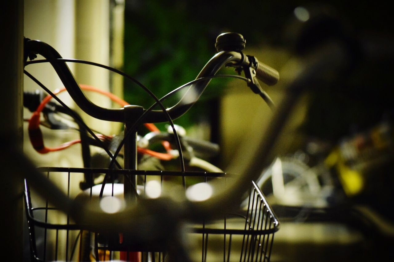 focus on foreground, indoors, illuminated, close-up, hanging, metal, lighting equipment, no people, selective focus, night, metallic, home interior, fence, sunlight, decoration, low angle view, light bulb, electricity