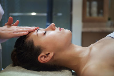 Woman with eyes closed at spa