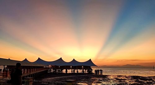 Scenic view of sea against orange sky