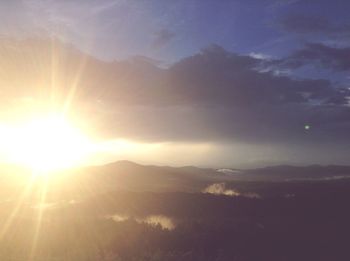 Scenic view of mountains against sky during sunset