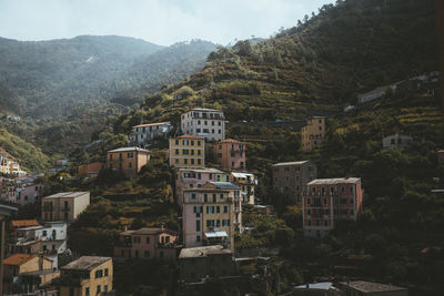 High angle view of townscape and mountains against sky