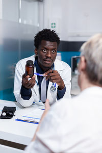 Doctor talking with patient in clinic