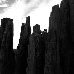 Low angle view of rock formation against sky