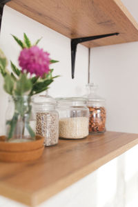 Close-up of flower vase on table at home