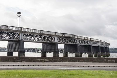 View of bridge against cloudy sky