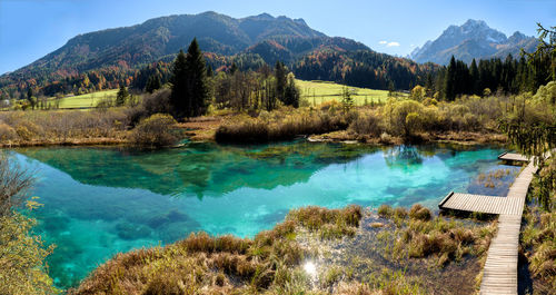 Scenic view of lake and mountains against sky