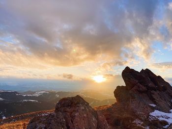 Scenic view of mountains against sky during sunset