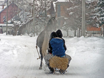 Rear view of man in snow