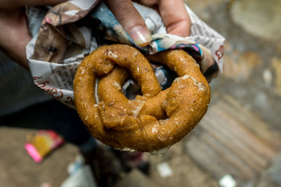 Close-up of hand holding burger