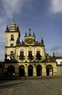 Facade of historic building against sky