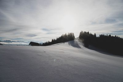 Scenic view of snowcapped landscape against sky