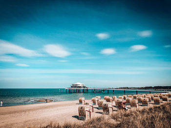 People on beach against sky