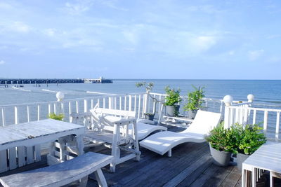 Scenic view of swimming pool by sea against sky