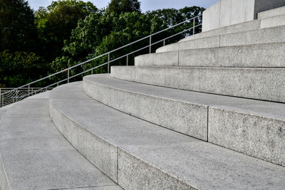 Staircase by trees against sky