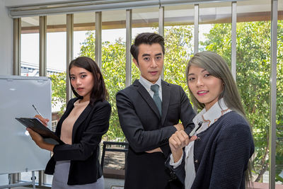 Portrait of business people standing in office