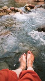 Low section of woman in river