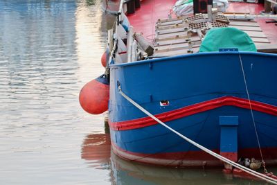 Boat moored at harbor