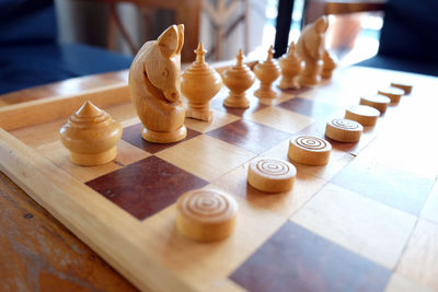 Close-up of chess pieces on table