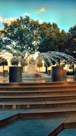 View of fountain in park against sky