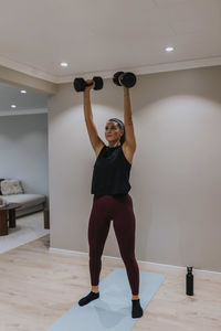 View of woman exercising at home