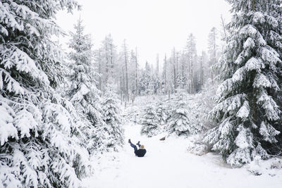 Person walking on snow covered land