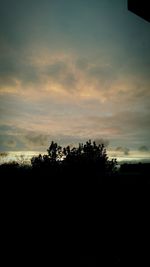 Scenic view of landscape against sky at sunset