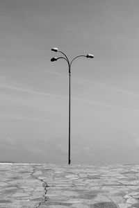 Low angle view of street light against sky