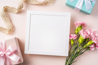 High angle view of pink flower on table