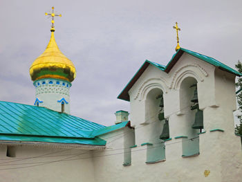 Low angle view of bell tower against sky