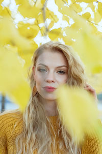 Portrait of young woman with yellow hair