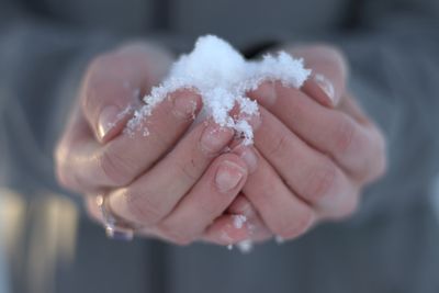 Close-up of hand holding ice cream