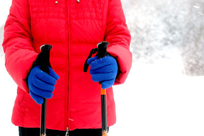 Red umbrella on snow covered landscape