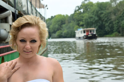 Portrait of woman by lake