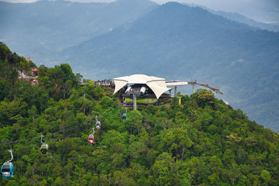 High angle view of trees and buildings against mountains