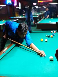 Man playing with ball on table