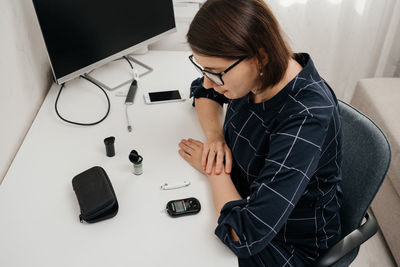 Side view of man using mobile phone