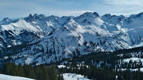 Scenic view of snowcapped mountains against sky